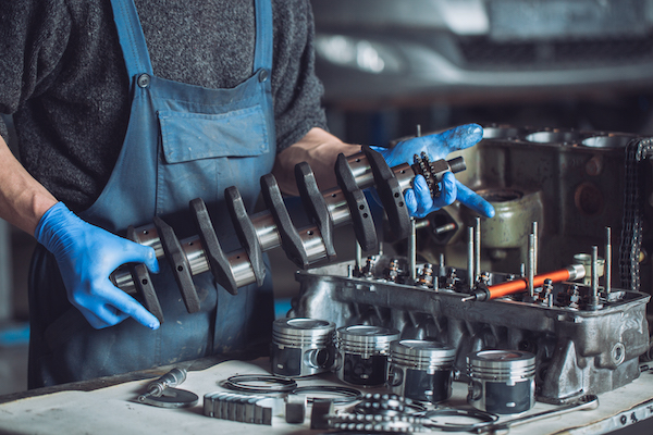 Master collects a rebuilt motor for the car.